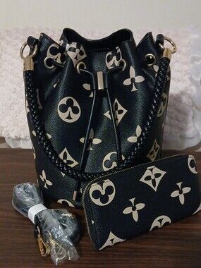 Black Drawstring Bucket Shoulder Bag with Gold Pattern and Matching Pouch